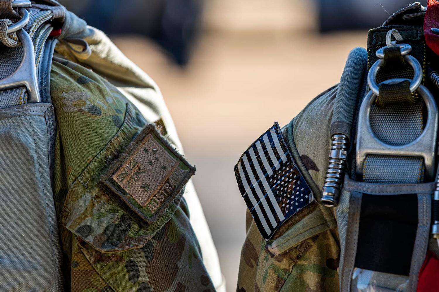 Australian and United States military personnel prepare to conduct free-fall parachute training together at RAAF Base Tindal, Northern Territory (Jake Sims/Defence Images